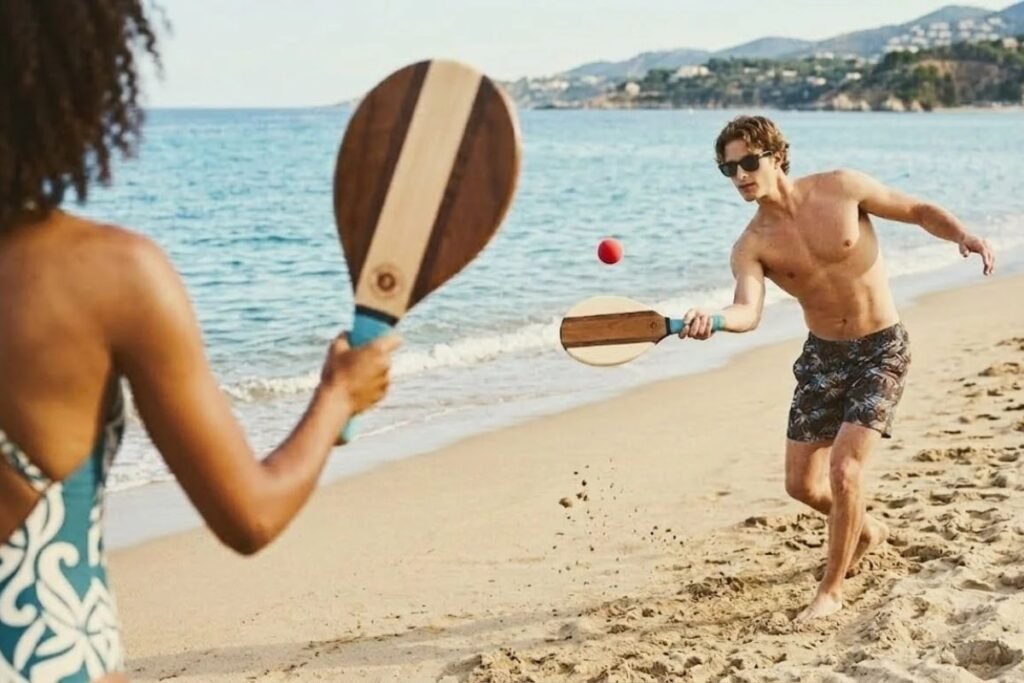 Beach tennis and frescobol are becoming increasingly popular in coastal destinations because they combine fitness, fun, and social interaction.